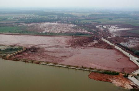 An aerial view of the broken dike of a reservoir containing red mud from an alumina factory near Ajka, Hungary on Tuesday, Oct. 5, 2010. (AP Photo/MTI, Gyoergy Varga)
