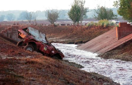A crushed off-road vehicle is seen on the banks of the Torna stream in the of village of Kolontar, Hungary on October 4, 2010. (INDEX ATTILA NAGY/AFP/Getty Images)